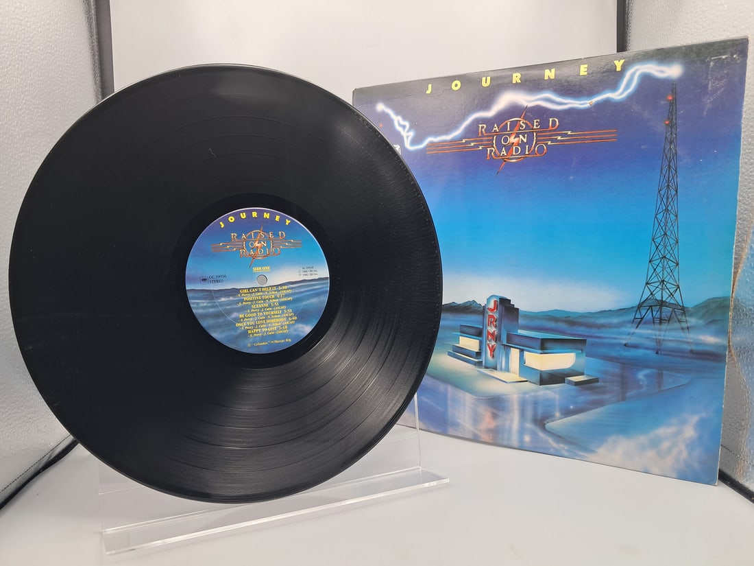 1986 Journey Raised On Radio Vinyl Album - OC 39936: 1986 Journey Raised On Radio Vinyl Album - OC 39936 - Records have not been tested by the auction house for play quality. All items are sold as is.