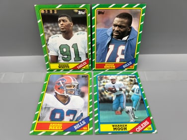 Lot of (4) 1986 Topps Football Star Player & Rookie Cards - Reggie White RC, Andre Reed RC, & Bruce