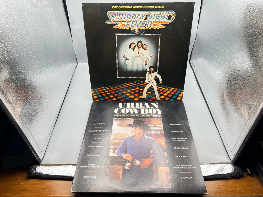 John Travolta - 2 LP Movie Soundtrack Lot: Saturday Night Fever (1977), gatefold, 2 LPs; and Urban: John Travolta - 2 LP Movie Soundtrack Lot: Saturday Night Fever (1977), gatefold, 2 LPs; and Urban Cowboy (1980), gatefold, 2 LPs, minor cover wear - Records are untested by auction house for play qua