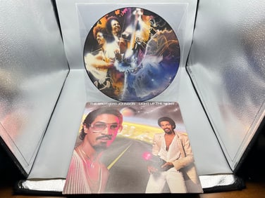 The Brothers Johnson: (2 LP Lot): Blam!! Picture Disc (1978), in clear polyvinyl envelope sleeve;
