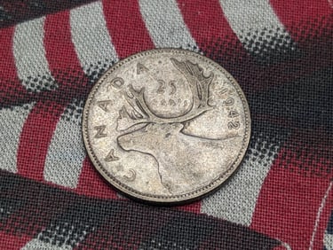 1942 - Silver Canadian 25 Cent Coin