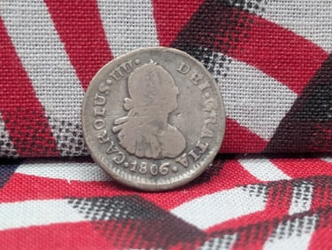 1806 Chile ½ Reale. 90% silver. Probably circulated in the early US. Hard to find.