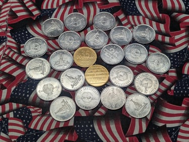Twenty-three Various Coin World Convention Tokens