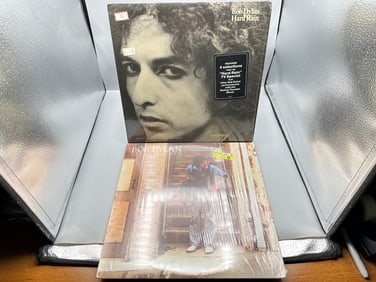 Bob Dylan (2 LP Lot): Hard Rain (1976), in original shrinkwrap w/hype sticker; and Street Legal
