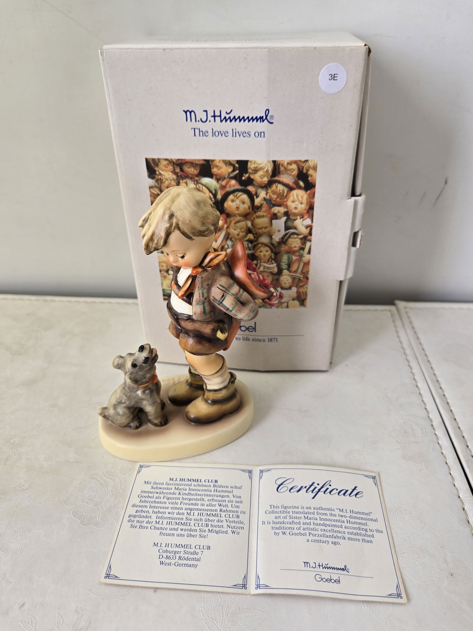 1993 Goebel M.J. Hummel 'Not For You! Nix f?r dich!' Figurine #317: An authentic 1993 Goebel M.J. Hummel porcelain figurine, titled 'Not For You! Nix f?r dich!' and numbered 317. The figurine depicts a young boy in traditional attire, holding a bundle behind his back,