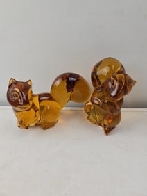 A Pair of Fostoria Amber Glass Squirrel Figurines