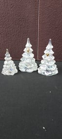 A Group of Three Fenton Art Glass Iridescent Christmas Tree Figurines, One with a Gold Bird, One
