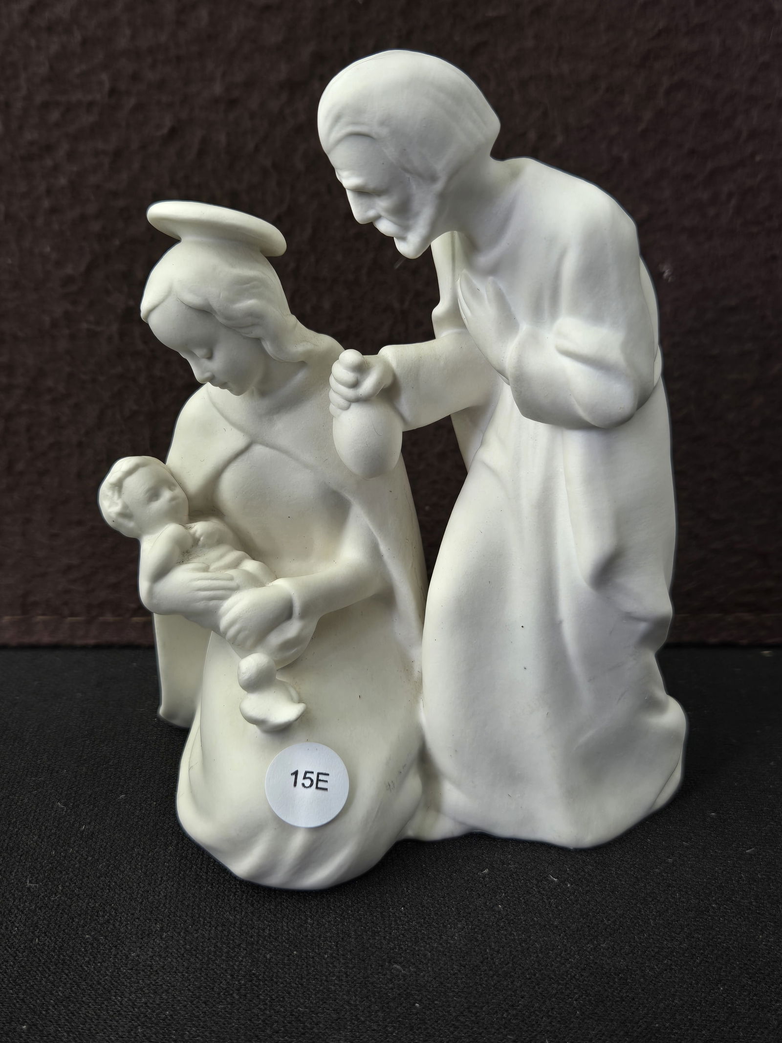 Vintage Goebel Sacrart Holy Family Nativity Figurine HX 252, W. Germany: A Goebel Sacrart Holy Family Nativity Figurine, model number HX 252, depicting Mary, Joseph, and Baby Jesus. Crafted from white ceramic with a matte finish, this group portrays Mary kneeling and cradl