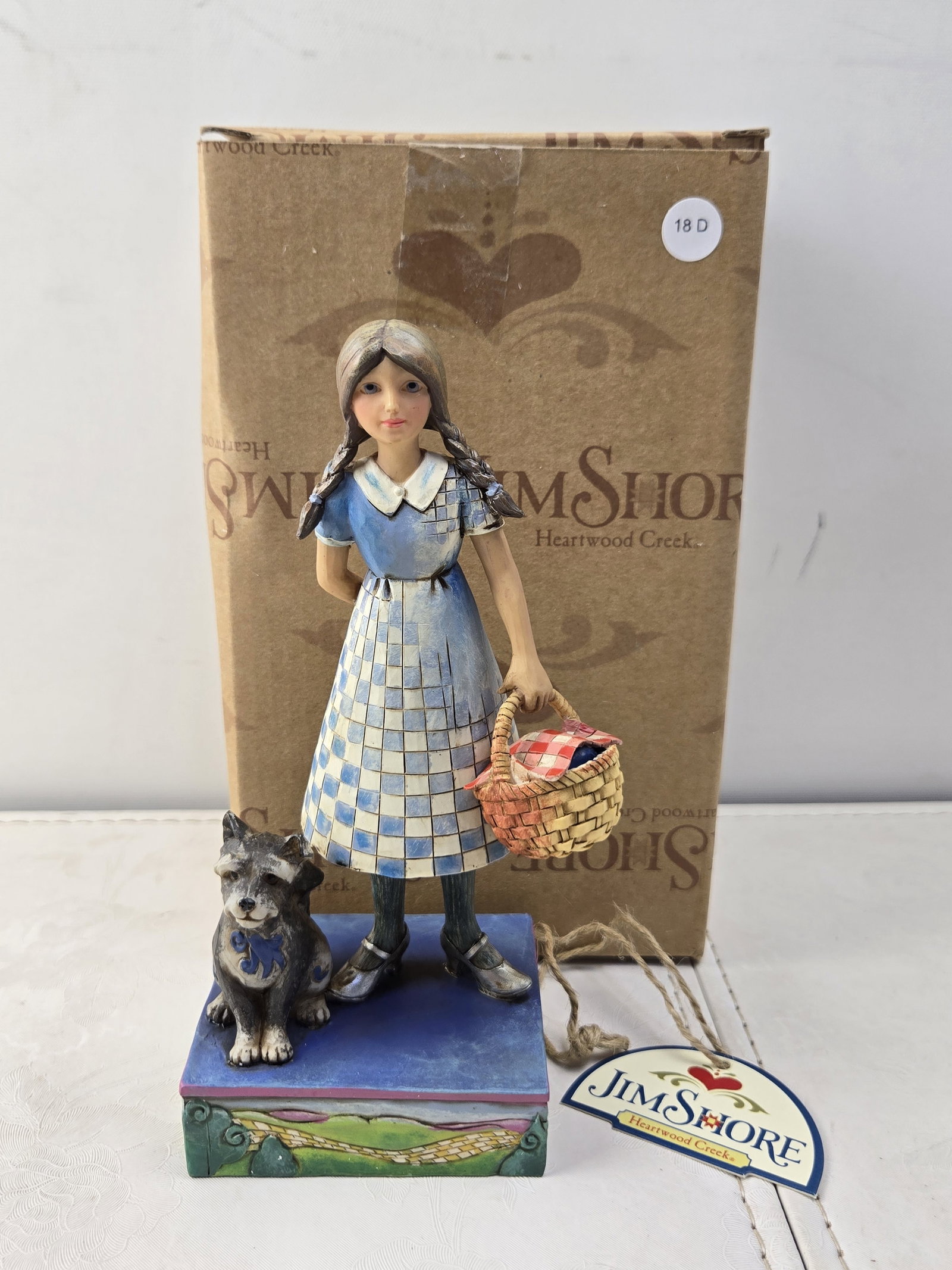 2007 Jim Shore Heartwood Creek The Wizard of Oz Dorothy & Toto "Go Where Your Dreams Take You": This is a 2007 Jim Shore Heartwood Creek hand-painted resin figurine, model number 4009045, titled "Go Where Your Dreams Take You." Licensed by Enesco, LLC, this piece depicts the iconic characters Do