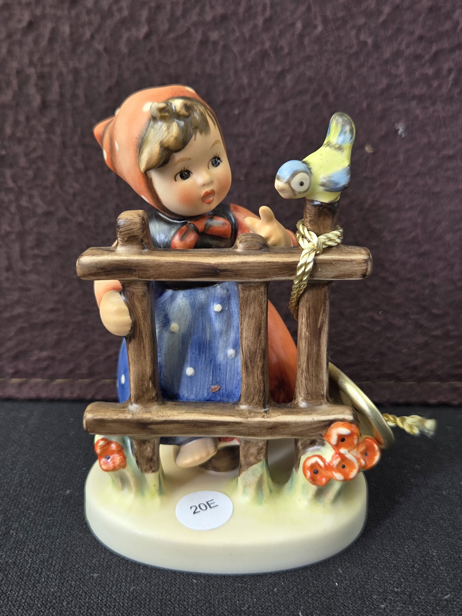 1990 Goebel Hummel "Signs of Spring" (Fr?hlingsidyll) #203 3/0 Final Issue: This is an authentic Goebel Hummel "Signs of Spring" (Fr?hlingsidyll) ceramic figurine, model number 203 3/0. The piece depicts a young girl in traditional attire, featuring a red kerchief, blue apron
