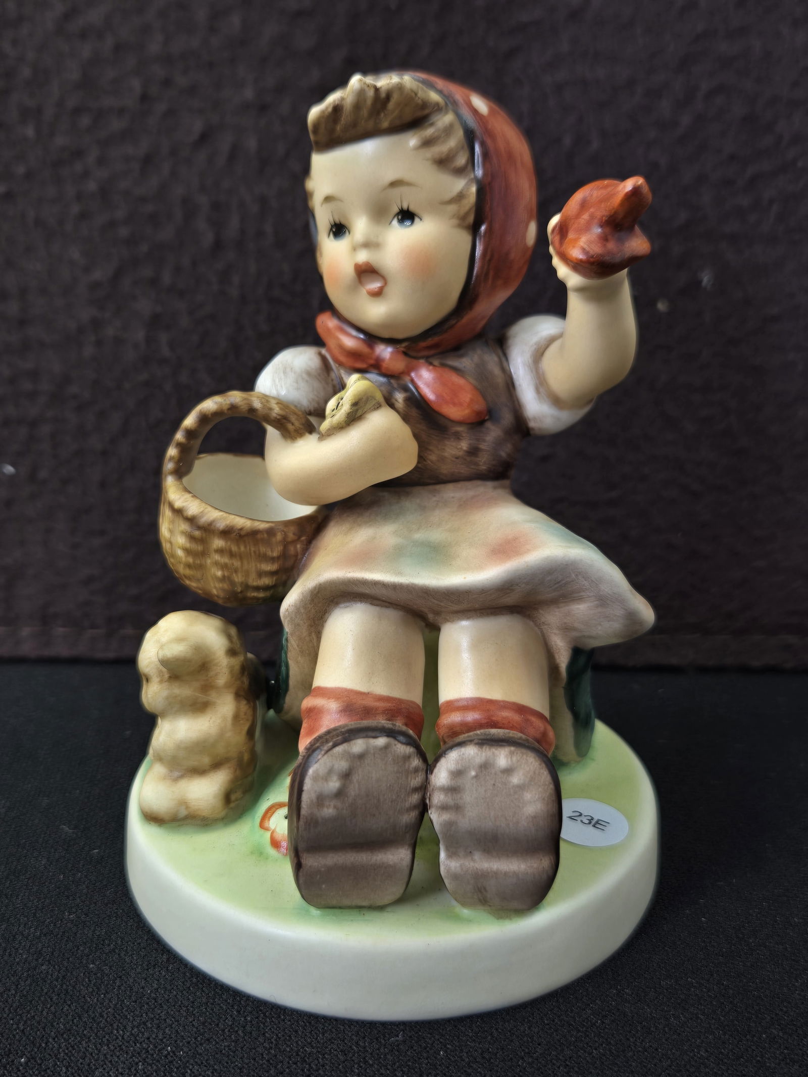 Goebel Hummel Farewell 'Auf Wiedersehen' Figurine #65: This is a hand-painted ceramic figurine by Goebel Germany, identified as Hummel #65, titled "Farewell" and further marked with an "Auf Wiedersehen" sticker on its base. The figurine depicts a young gi