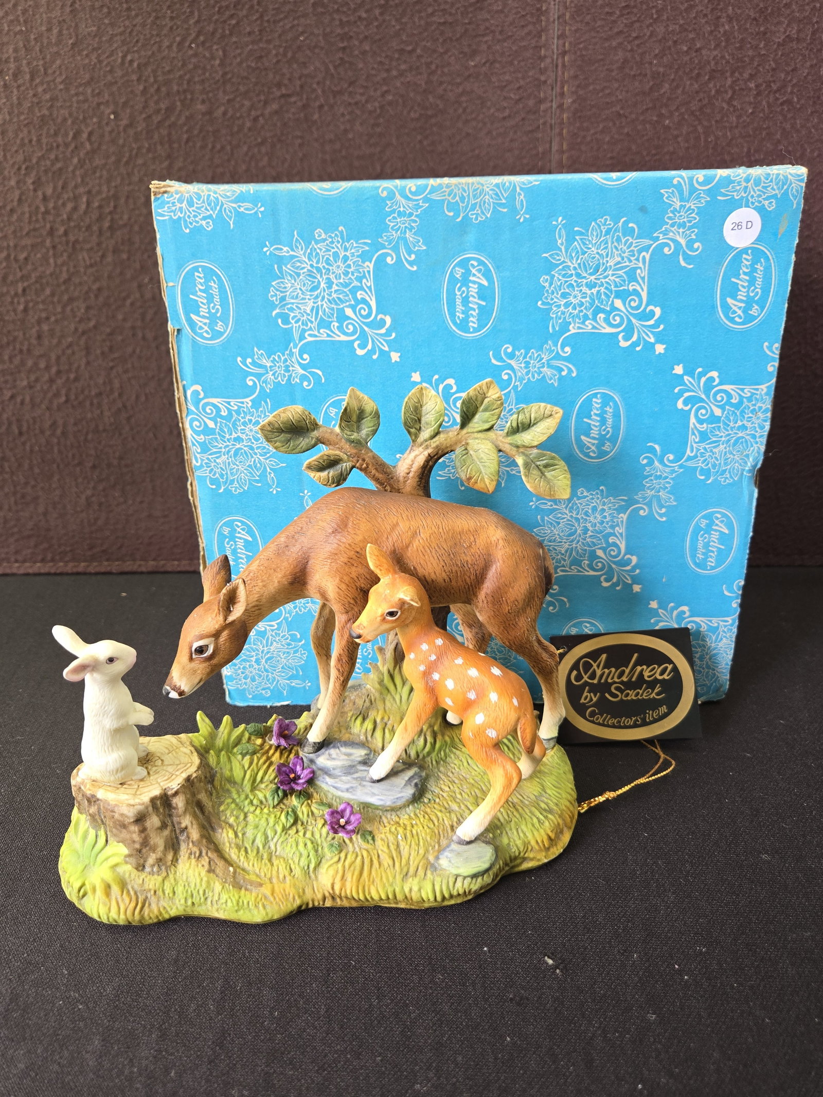 Andrea by Sadek Deer Family Figurine #6648: This porcelain figurine, identified as "Deer Family by Andrea" with model number 6648, was manufactured by Andrea by Sadek in Japan. The piece depicts a heartwarming nature scene featuring an adult de