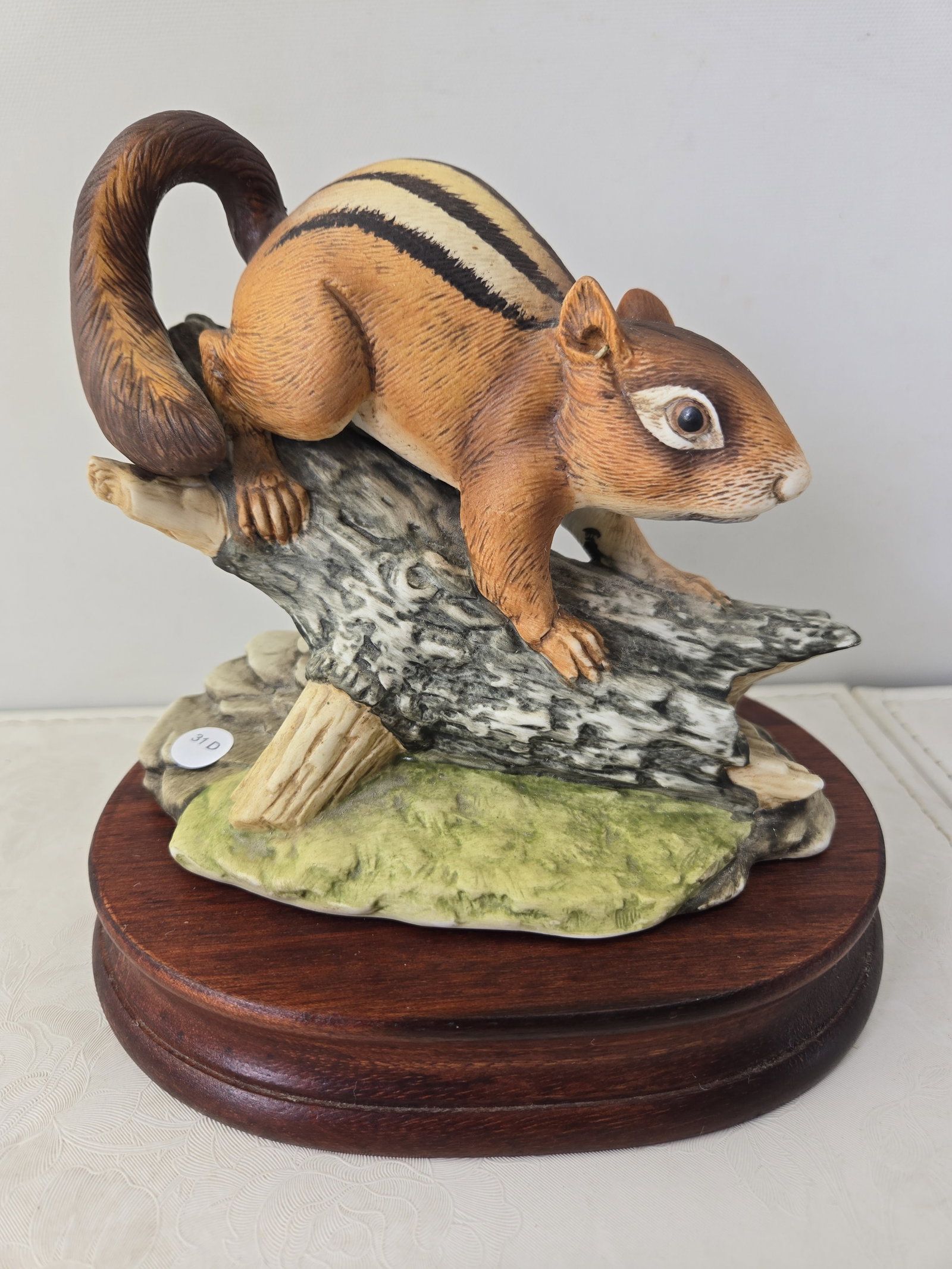 Andrea by Sadek Hand Painted Chipmunk Figurine #5933: This listing features a charming glazed porcelain figurine by Andrea by Sadek, identified as 'Chipmunk' with model number 5933. The piece depicts a chipmunk in a naturalistic pose, climbing on a tree 