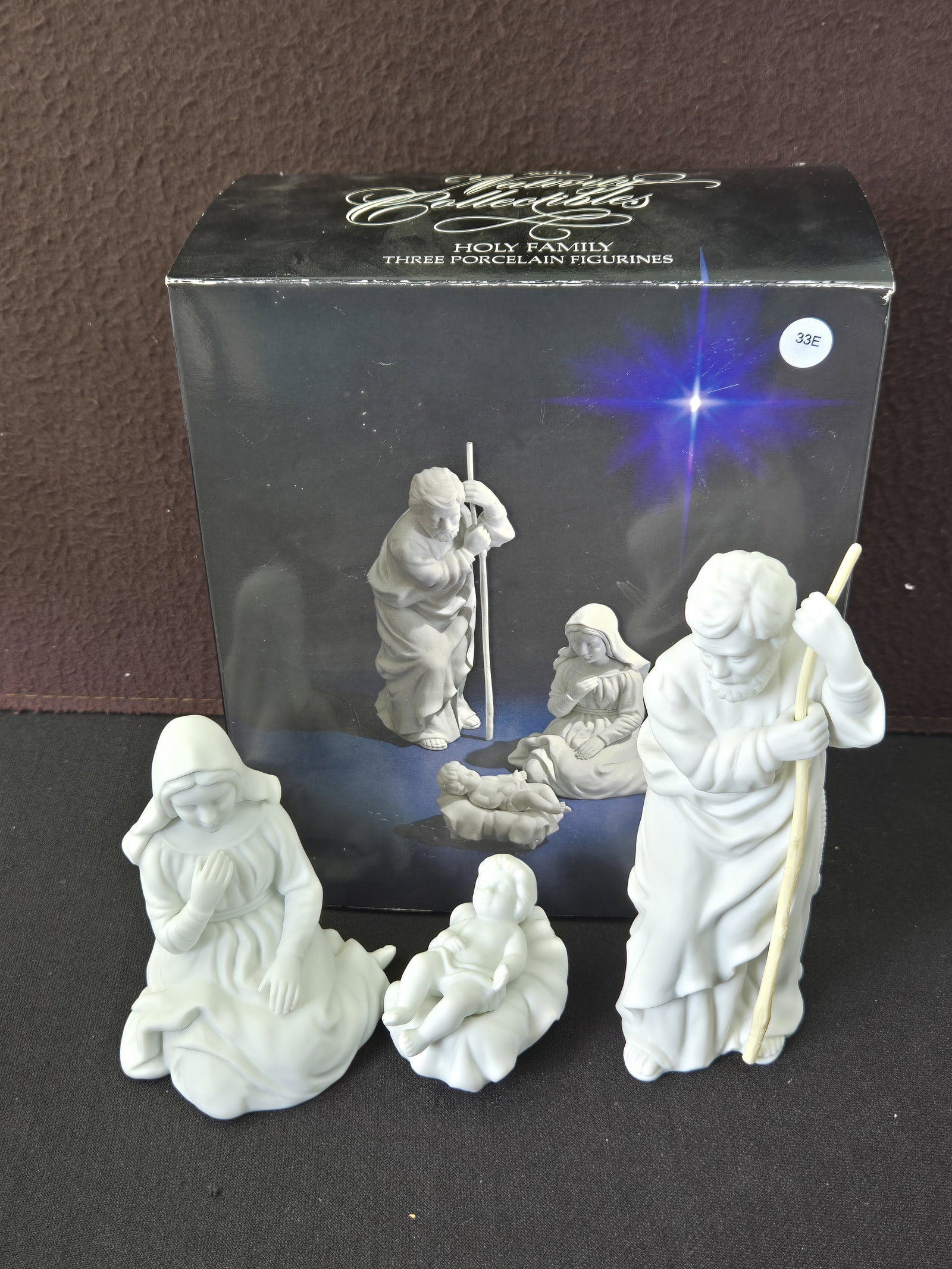 1981 Avon Nativity Collectibles Holy Family Three Porcelain Figurines: A set of three 1981 Avon Nativity Collectibles 'Holy Family' porcelain figurines. The set features Mary, Joseph (holding a staff), and baby Jesus in a manger, all crafted from white, unglazed porcelai
