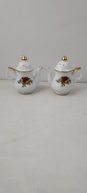 A Pair of Royal Albert Old Country Roses Teapot Shaped Salt and Pepper Shakers
