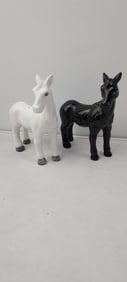 A Pair of Vintage Mid-Century Glossy Black and White Ceramic Horse Salt and Pepper Shakers