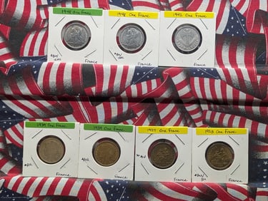 Seven French Coins-1923, 1927, 1939x2, 1942 One Franc & 1948x2 One Franc Reunion
