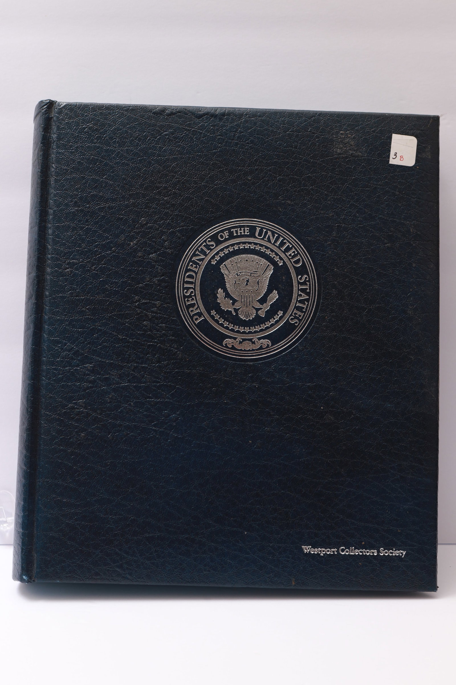 Presidents of the United States Stamp and Cover Album: This lot consists of a hardcover album titled Presidents of the United States, issued by the Warsport Collector Society, dated 1976. The album contains illustrated biographical pages for each presiden