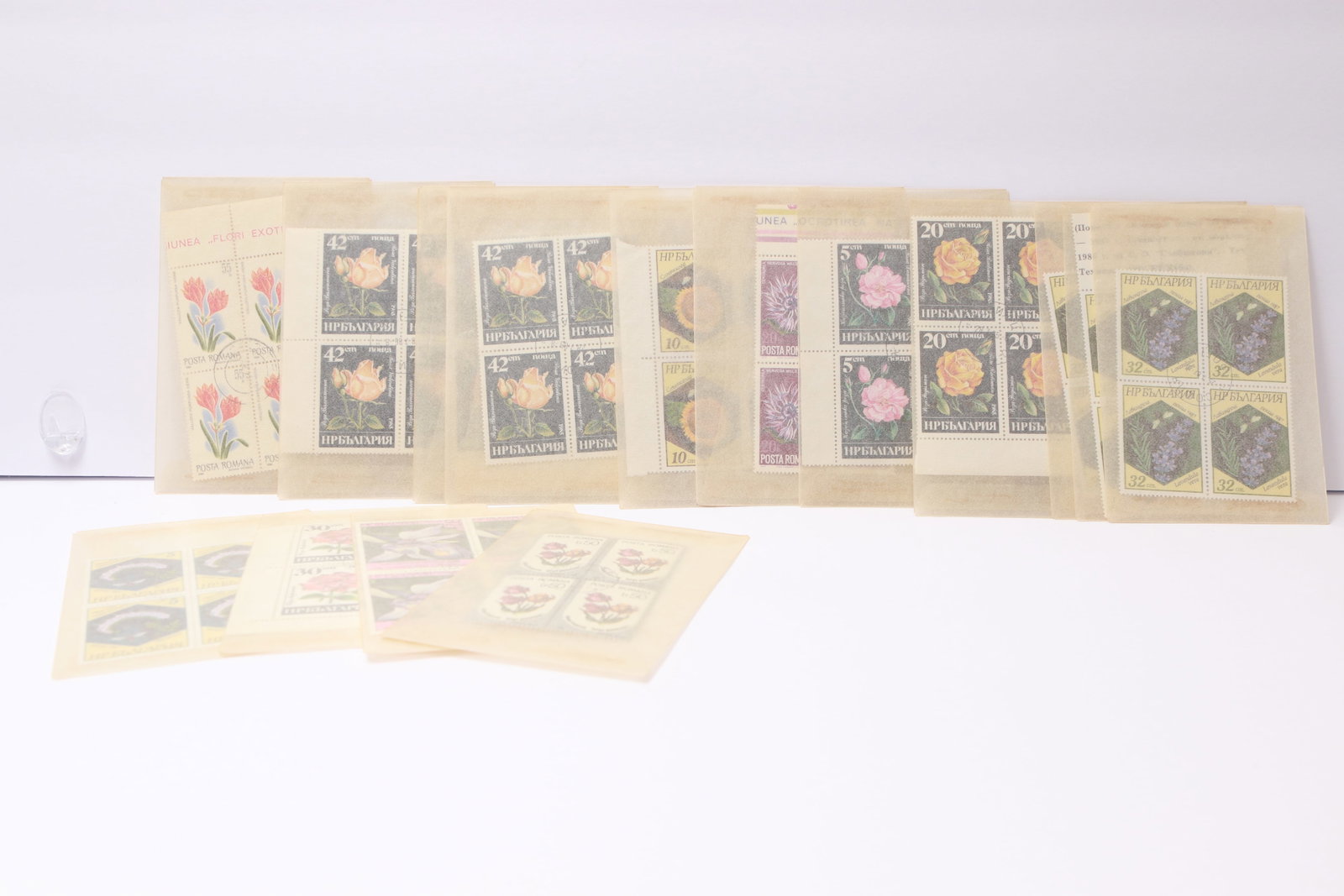Bulgaria Flora-Themed Stamp Blocks: This lot contains Bulgarian stamp blocks, all featuring floral themes. Included are multiple blocks of the 32 st. purple blossoms, 20 st. yellow rose, and 42 st. rose issues. Additional blocks depict 