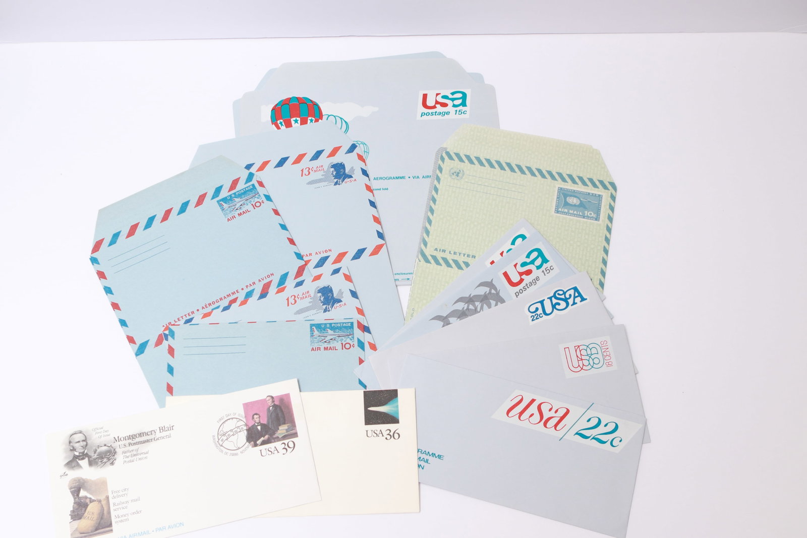 U.S. Aerogrammes – Assorted Issues: This lot includes unused U.S. aerogrammes: the 15¢ Swallows design, the 15¢ Hot Air Ballooning issue, the 36¢ Halley’s Comet issue referencing Mark Twain’s life and death alongside the comet’