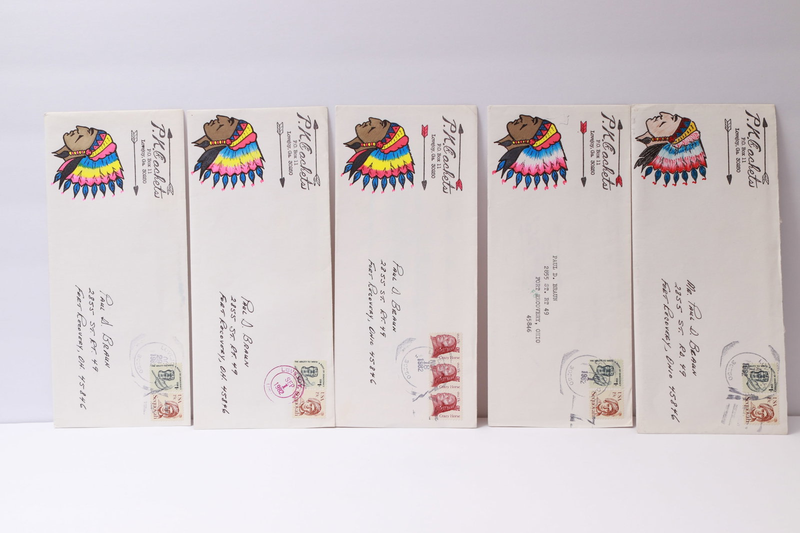 Hand-Drawn Cacheted Covers by P.J. Ceketis: This lot contains five hand-drawn and hand-colored cacheted envelopes by P.J. Ceketis of Touchet, Washington. Each cover features a Native American chief in a colorful feathered headdress, with variat