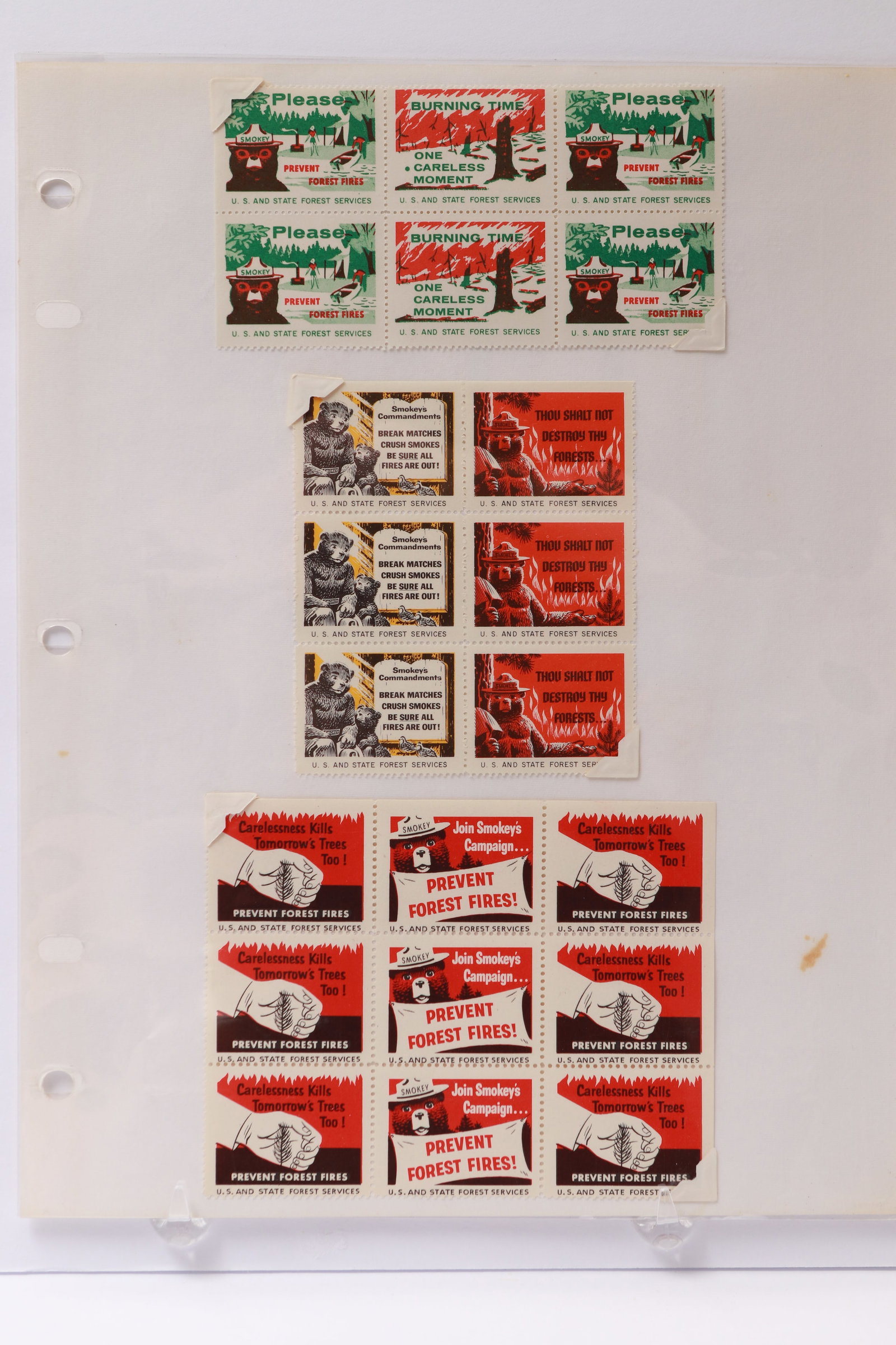 Smokey Bear Forest Fire Prevention Labels and Wilkinsburg Stamp Club Souvenir Sheets: This lot includes U.S. Forest Service fire prevention labels featuring Smokey Bear in various designs, with multiples in blocks of four and larger, carrying slogans such as “Please Prevent Forest Fi