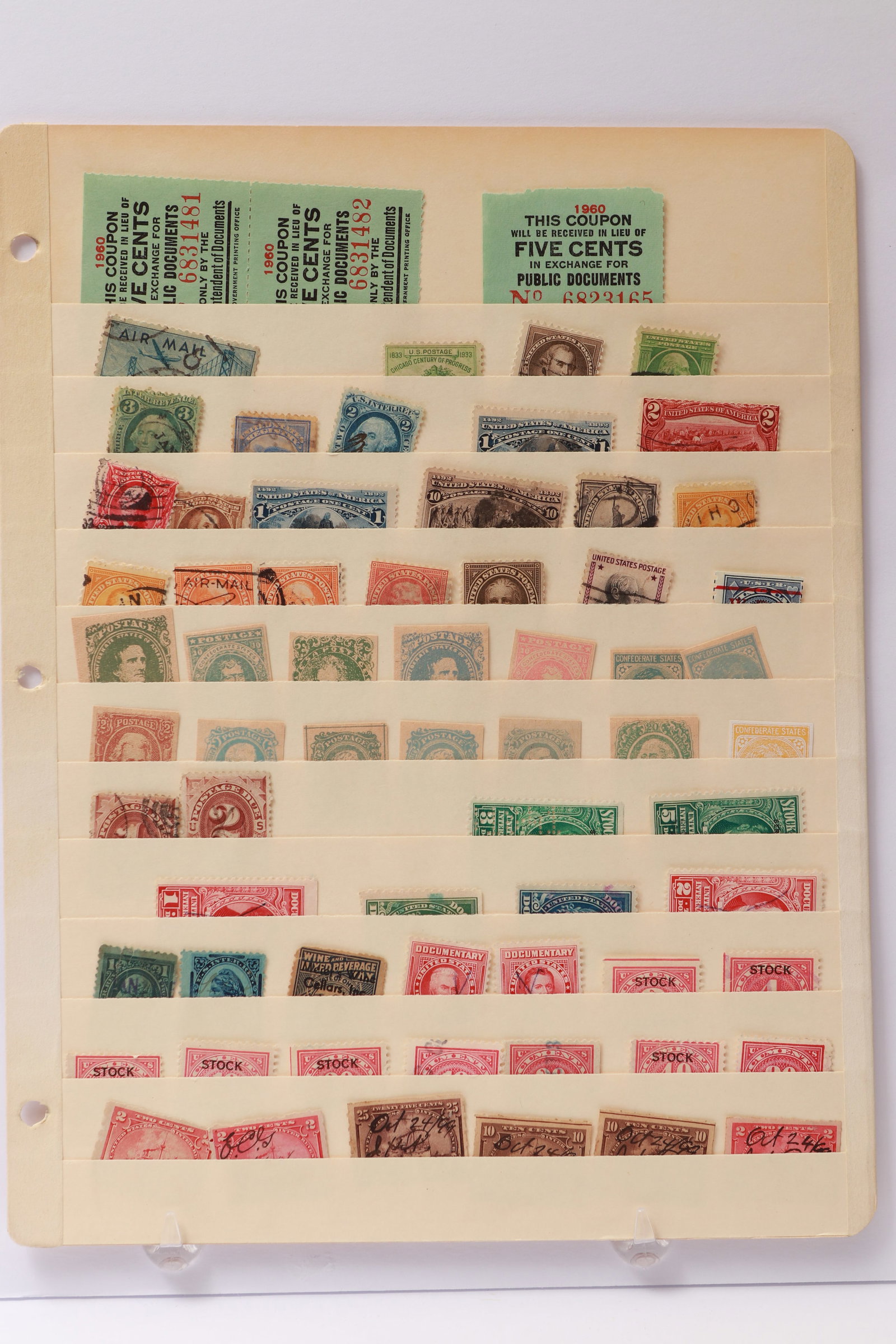U.S. Postage, Revenue, and Document Stamps Assortment: This lot contains a mixed selection of U.S. postage, revenue, and documentary stamps housed on a single album page. Included are early U.S. postage issues such as Washington and Franklin series, Airma