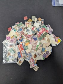 Large mixed lot of loose U.S. stamps with a wide range of commemoratives, definitives and older