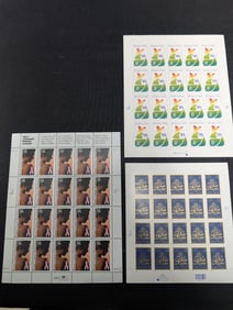 Three full sheets of modern U.S. postage including Breast Cancer Awareness, Hospice Care and Eid