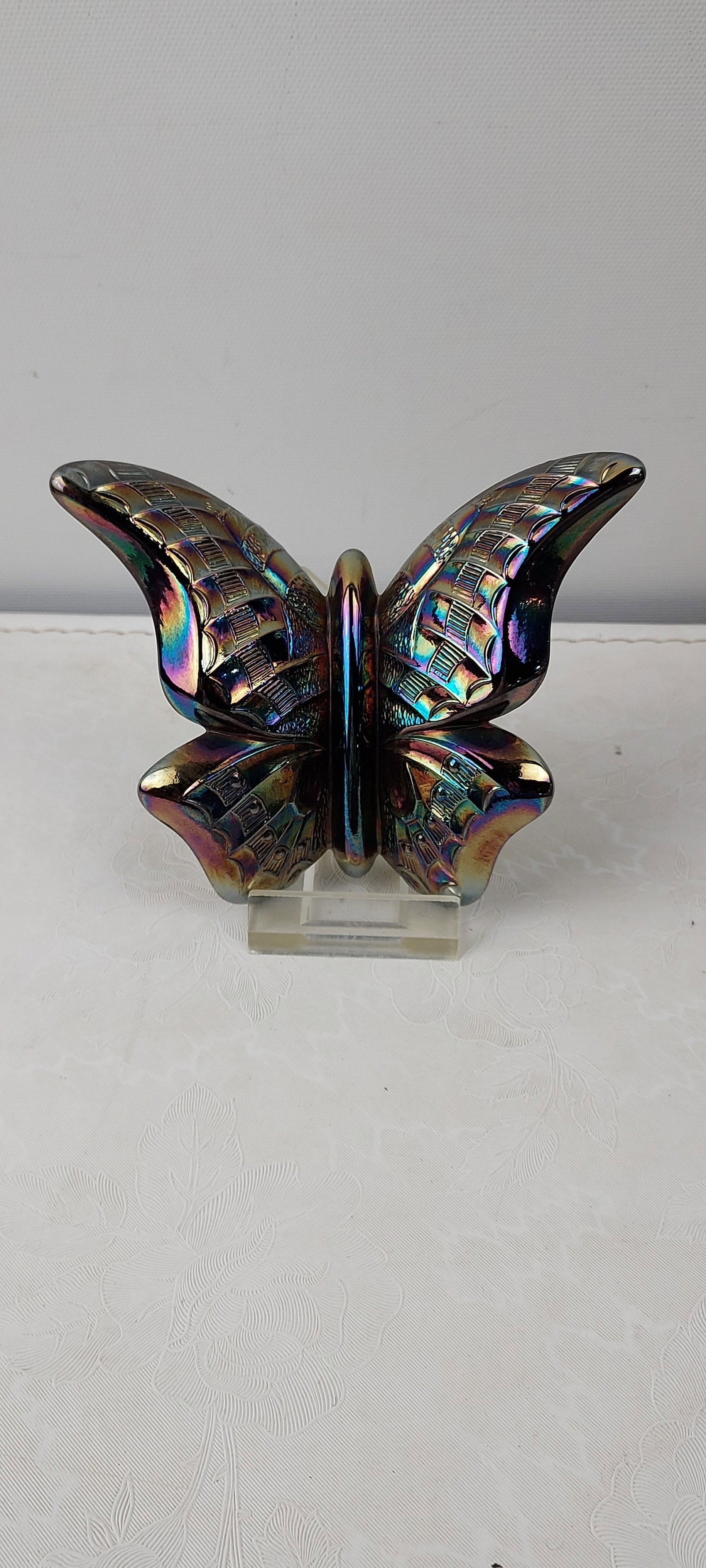 1971 Fenton Amethyst Iridescent Carnival Glass Butterfly Ring Holder: A 1971 Fenton Amethyst Iridescent Carnival Glass Butterfly Ring Holder, identified by the handwritten label as model #1261. This exquisite figurine features textured wings and an iridescent finish cha
