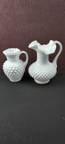 A Pair of Vintage Fenton Milk Glass Hobnail Pitchers, including a Ruffled Ice Lip Jug