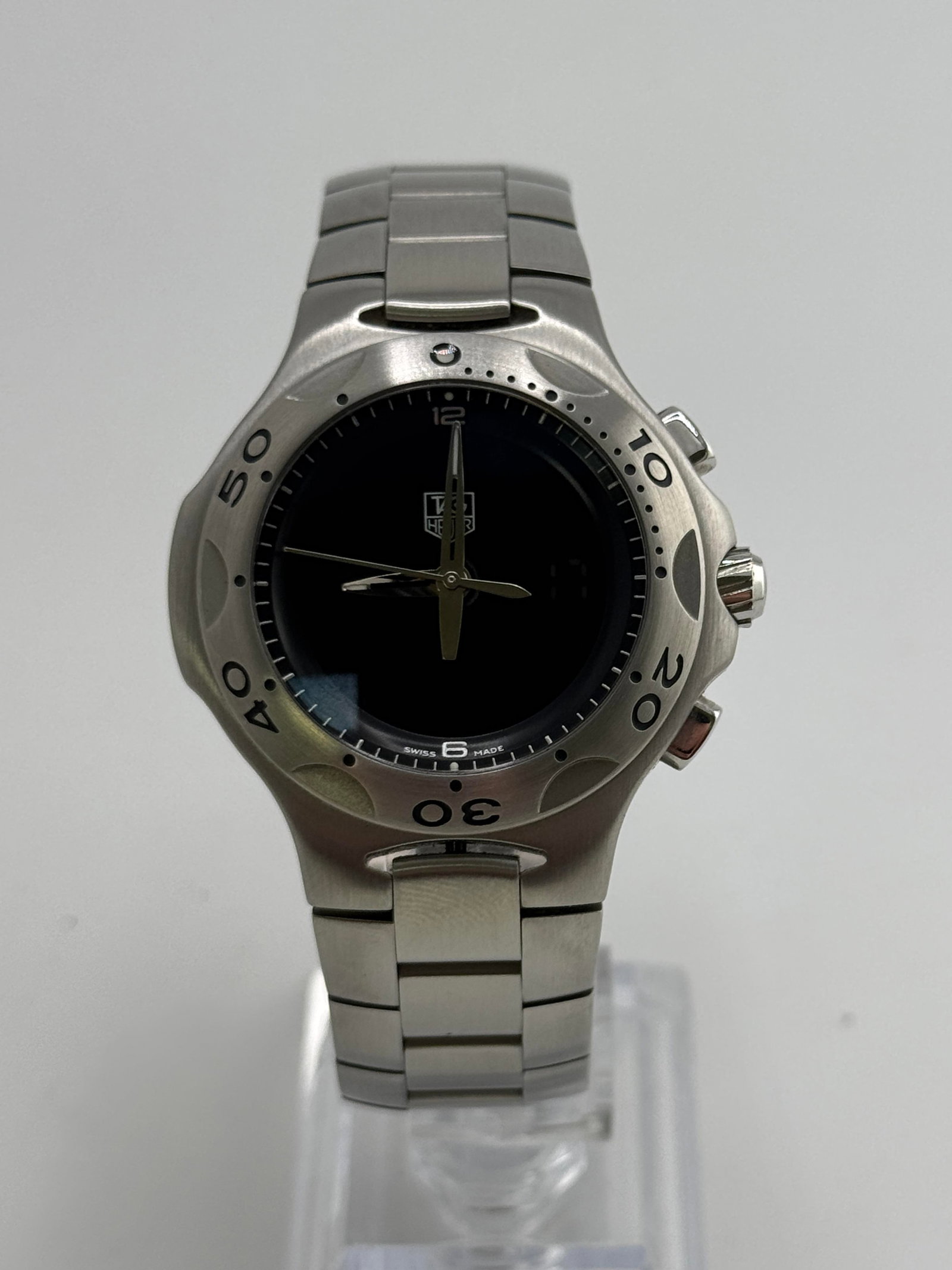 Tag Heuer CL111A analogue/digital watch: Tag Heuer CL111A analogue/digital watch, with box papers, working at the time of catalogue The working order, accuracy or any implied water resistance of any lots sold is not guaranteed. For more