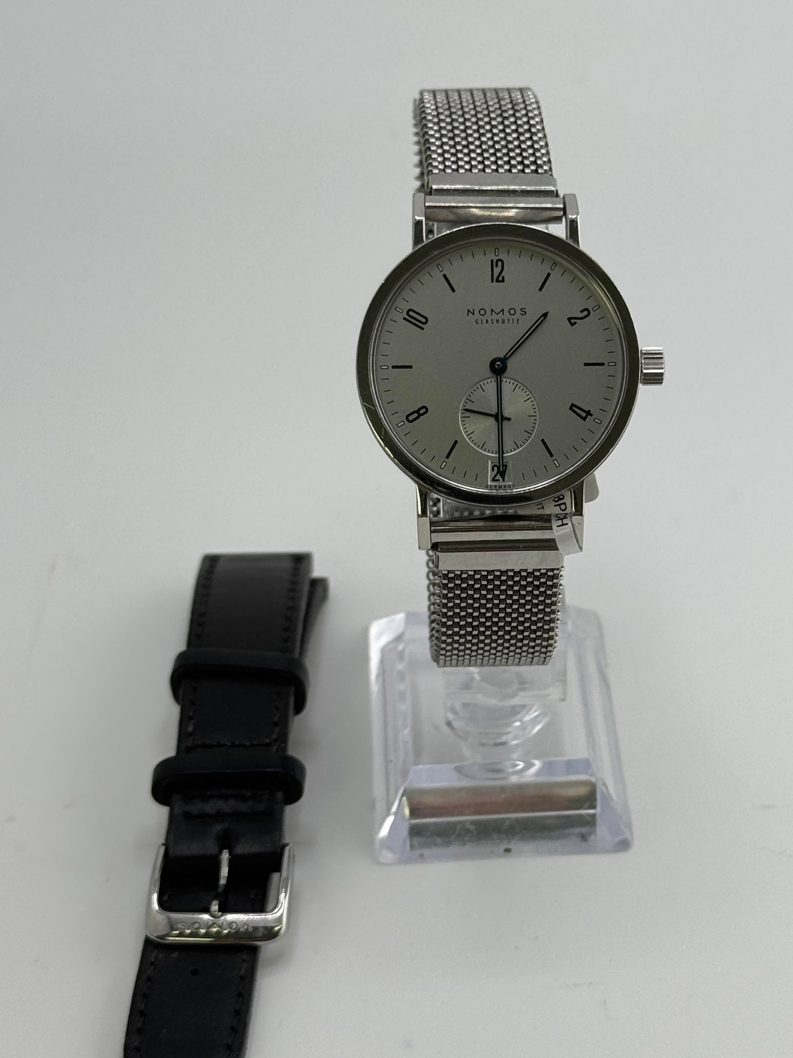Nomos Tangente Sport 6717 Watch: Nomos Tangente 6717, 35mm, with box, working at the time of catalogue The working order, accuracy or any implied water resistance of any lots sold is not guaranteed. For more information