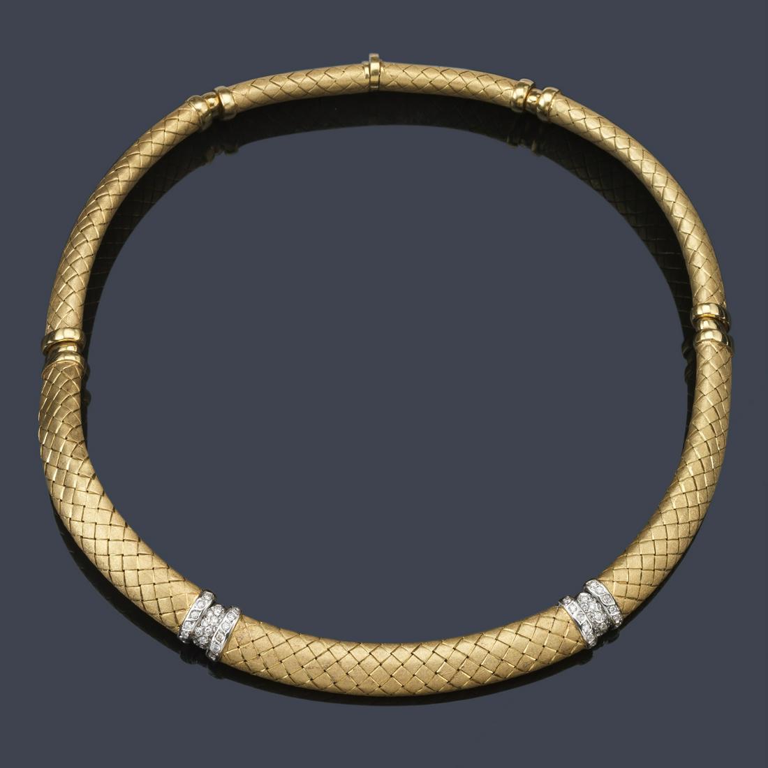 Semi-rigid style choker in matte 18K yellow gold and: Semi-rigid style choker in matte 18K yellow gold and wheat design. Features two motifs in 18K white gold and set with brilliants.