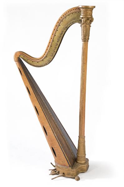 Wooden harp model Brown, nº 28 of Impasse Cendrier,: Made of carved, golden and polychrome maple root wood. Striated column with carved capital with rams' heads and vegetated elements. Seven pedals, with claw-shaped legs. Manufacturing and owner's plate