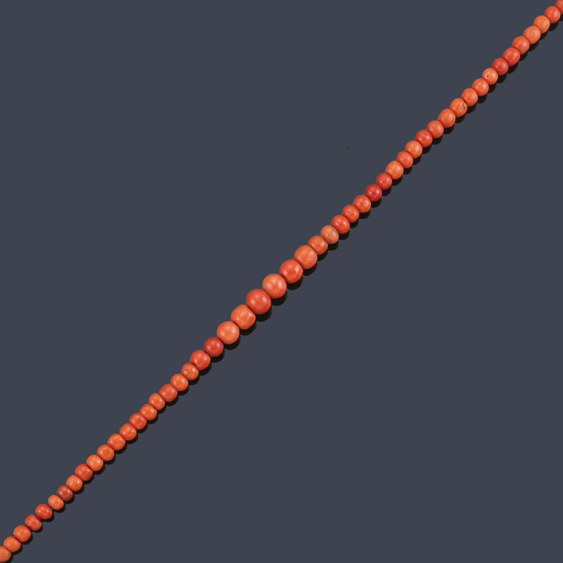 Necklace of spherical coral beads arranged in (1 of 1)