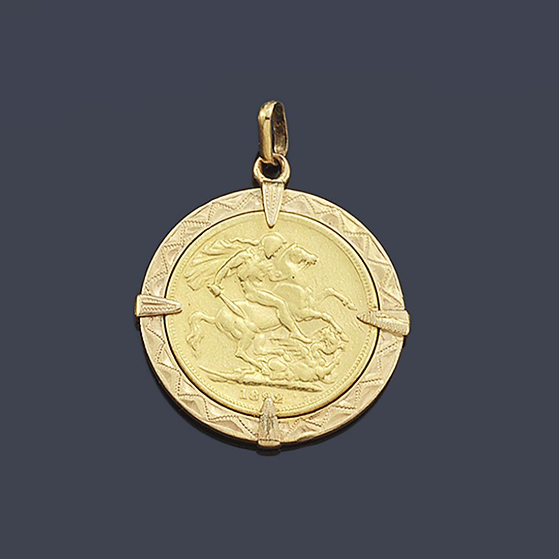 18K yellow gold pendant framing a 22K gold English one: 18K yellow gold pendant framing a 22K gold English one pound coin.