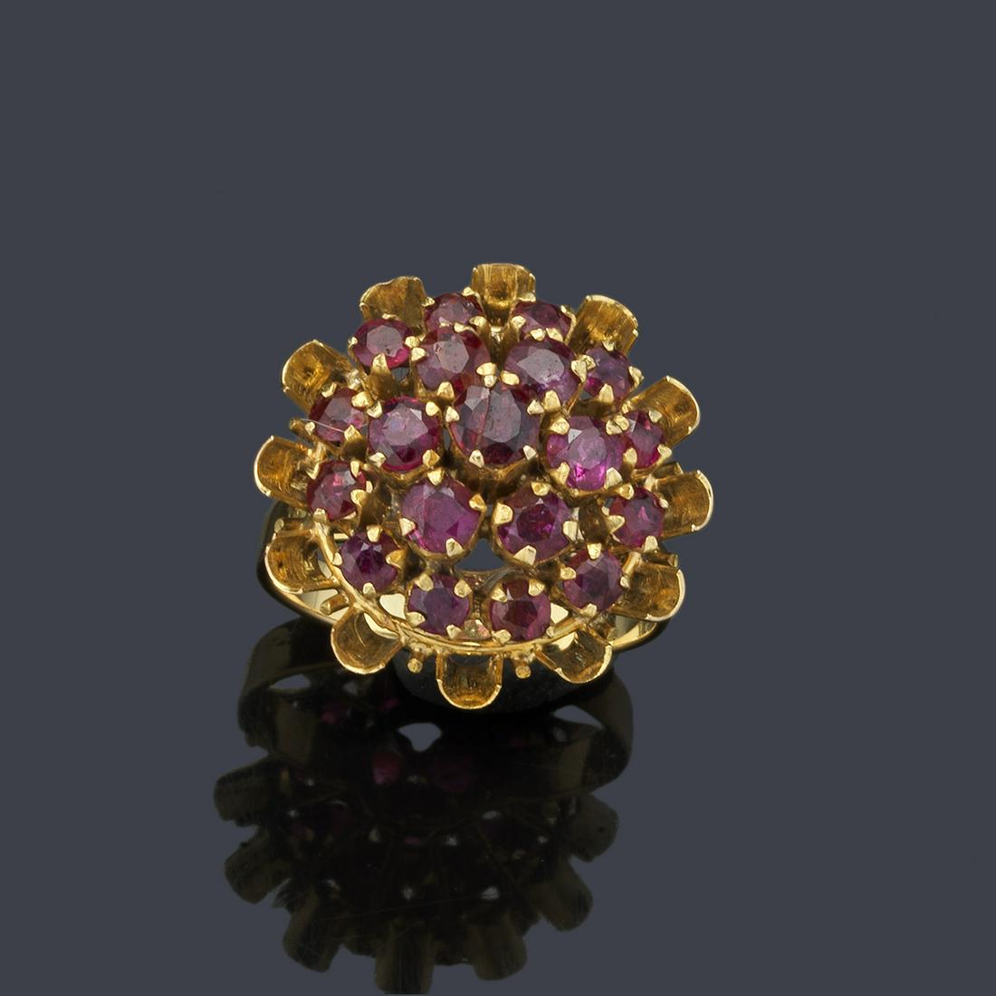 Rosette ring with rubies: Rosette ring with rubies in raised 18K yellow gold setting.