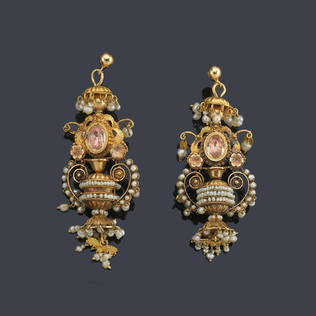 Long earrings with a central motif in the shape of an: Long earrings with a central motif in the shape of an amphora enriched with pearl beads, with a cap and a finish of hanging pearls made in 18K yellow gold filigree. 19th century. With modified pressur