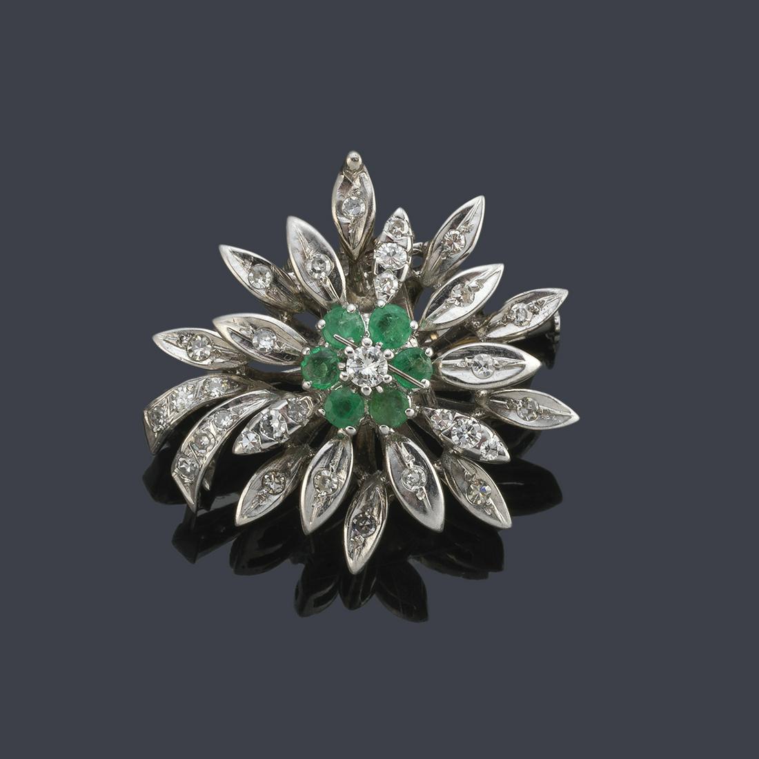 Rosette-shaped brooch with emeralds and diamonds in 18K: Rosette-shaped brooch with emeralds and diamonds in 18K white gold settings.