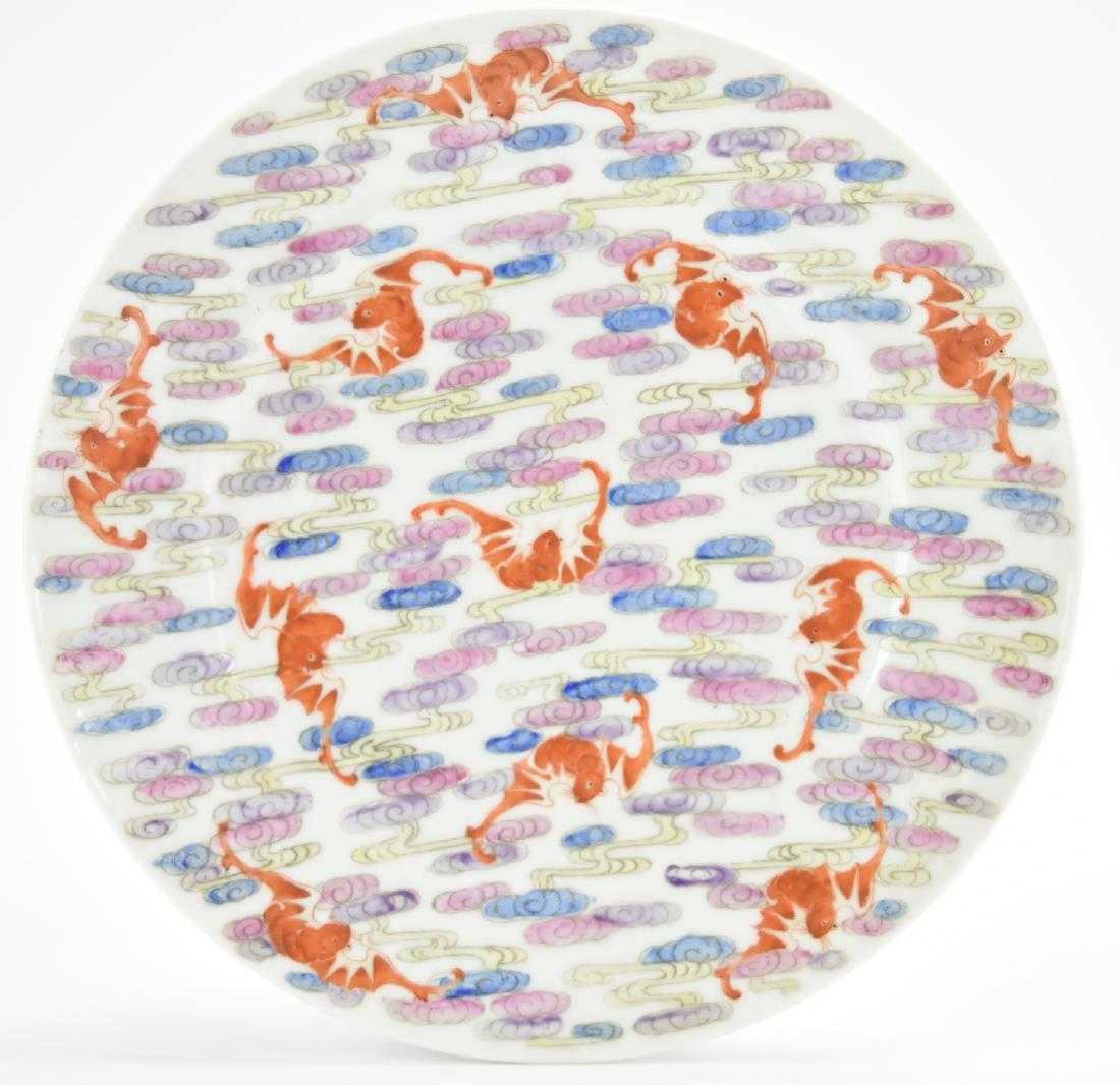 Chinese Famille Rose Bat & Cloud Dish,19th C.: A Chinese porcelain plate painted with uniformly sized & spaced groups of pink and purple clouds and 11 iron-red bats in various poses. Six red characters mark the underside. D.9 in.(23cm) Condition: