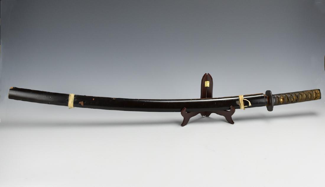 Japanese Officer's Sword: WW II Type 98 Gunto: A pre 1945 type 98 Japanese Officer's "Gunto" sword with: wood lined painted metal scabbard, painted metal guard, cloth wrapped ray-skin hilt, brass blade collar, single brass mount, and cherry-blosso