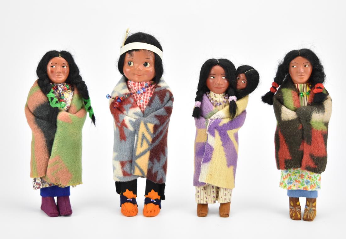 Group of 4 Medium Size Indian Skookum Dolls: A group of 4 medium sized Skookum dolls, original clothes, beaded necklaces, condition, one with tag on foot. H: 10" (tallest one) Condition: in good condition Provenance: From the estate of a private