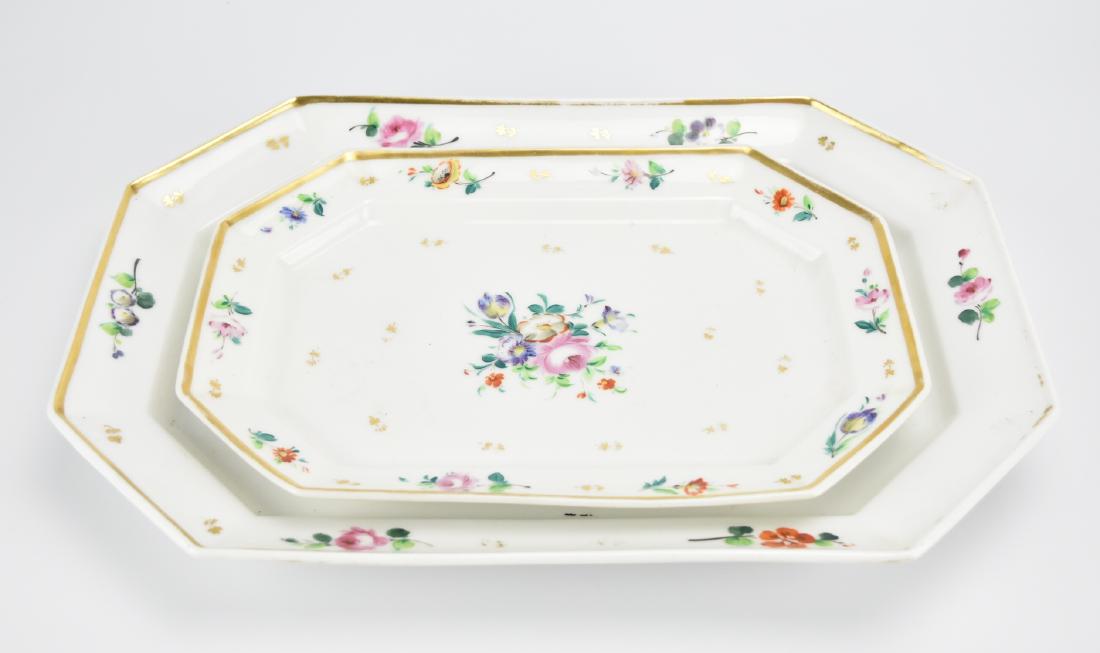 2 Handpainted Old Paris Porcelain Serving Platters: A pair of Old Paris, gilded, white porcelain serving platters of hexagonal/ rectangular form with matching hand painted floral spray pattern. L: 17 1/4" (43.8cm) Longest