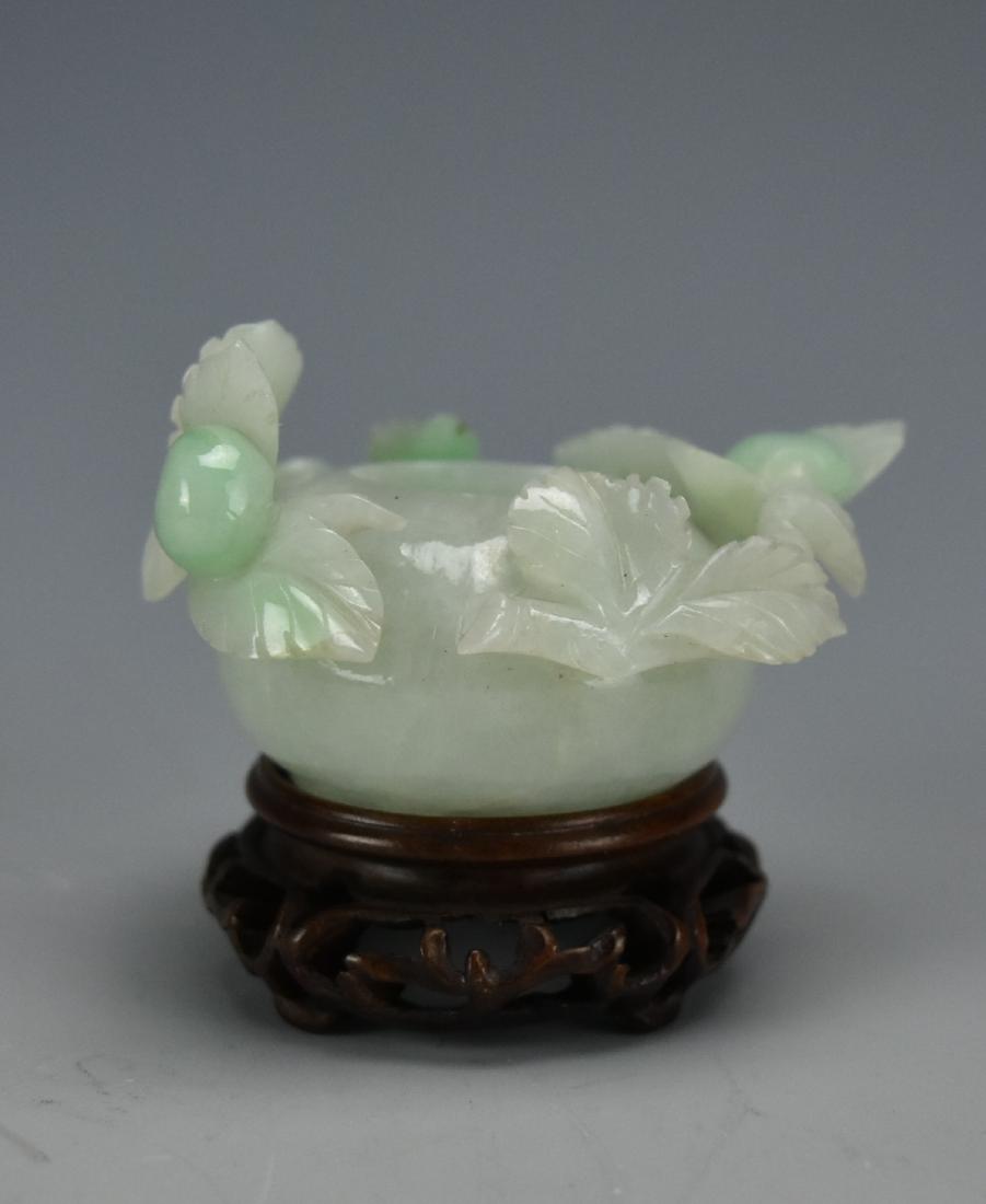 Small Jadeite "Berries & Leaves" Censer w/ Stand: A small, pale, green & white, marbled, jade censer carved in high relief with berries and leaves around the opening. Comes with a sculpted dark wood stand. D: 2 3/4" (7cm)