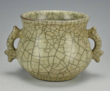 A Ge-Type Censer w/ Ears: A Chinese, ceramic, Ge-ware censer of archaistic Gui form with twin side handles and flared lip. W: 5 5/8" (14.3cm) Condition: In good condition with a circular pattern of small raised glaze-breaks in