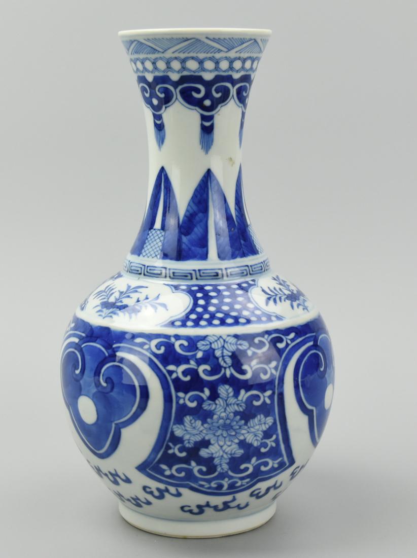 Chinese B & W Vase w/ Varied Decoration,19th C.: A blue & white, Chinese, porcelain vase, globular with waisted neck, painted with large ruyi shapes, floral scroll, sprays of flowers, palm fronds, & other decoration, the underside with concentric bl