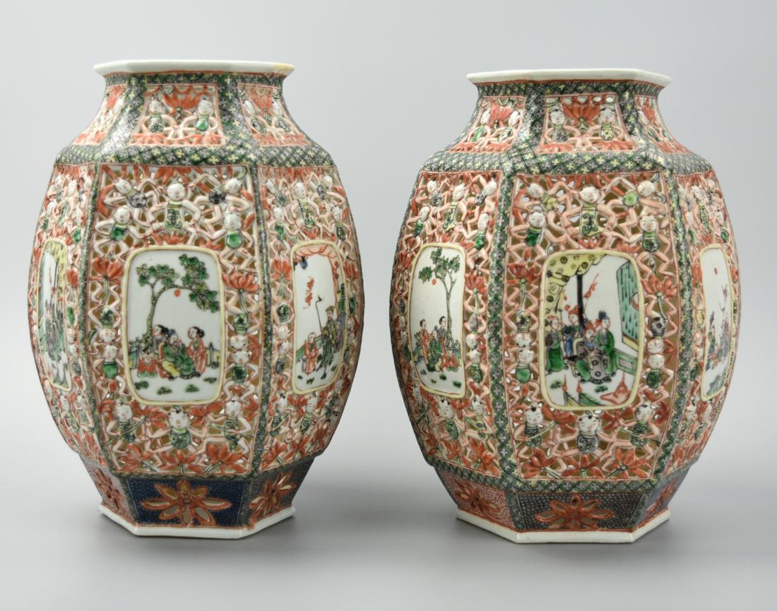 Pair of Hexagonal Famille Verte Lantern ,19th C.: A pair of hexagonal, famille verte, Chinese, porcelain lanterns with paneled illustrations within the openwork walls, these showing assorted scenes of figures: walking, drinking, drumming. The lattis 