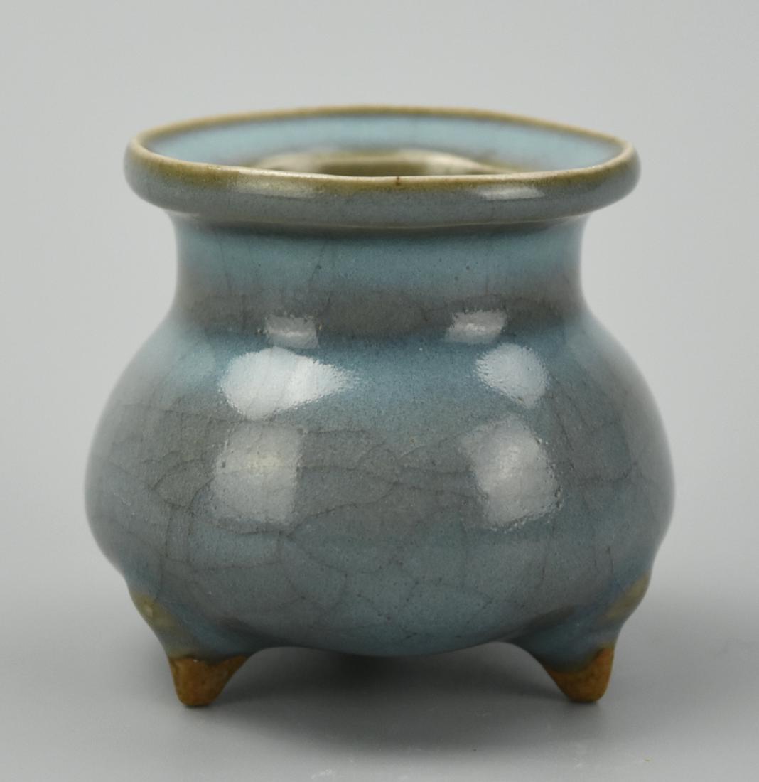 Small Chinese Jun Ware Tripod Censer,Song Dynasty: A small, Chinese, ceramic tripod censer of round body with straight neck & everted angled lip, glazed with crackled shifting tones of cerulean & greyish- greenish brown. H: 2 3/8 in.(6 cm) D: 2 9/16" 