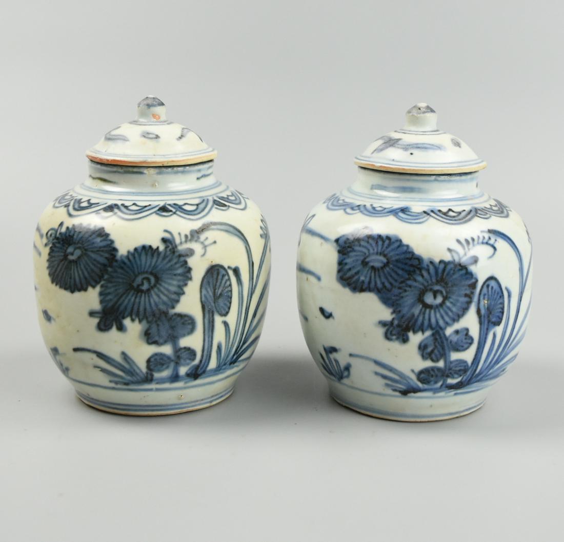 Pair of Chinese B & W Jar & Cover, Ming Dynasty: A blue & white, Chinese, porcelain jar with lid of ovid form with short waisted neck, painted with evenly spaced: foliage, flowers and floral scrolls pattern on the top and sides. H: 5 3/4"(14.5cm) D: